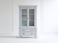 Estantería de madera 120x40x200 cm blanca con 2 puertas de cristal y 2 cajones estilo clásico